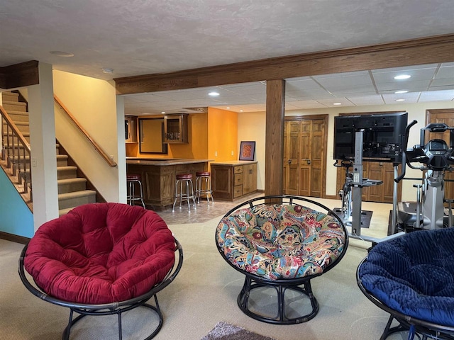 interior space with baseboards, stairway, carpet flooring, recessed lighting, and wet bar