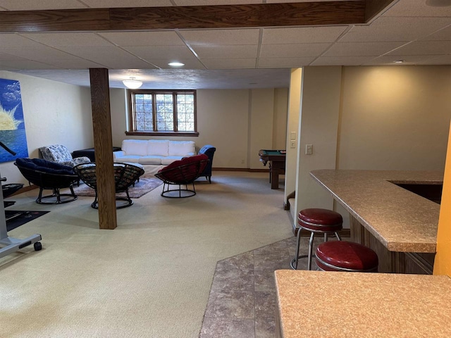 interior space with baseboards, a paneled ceiling, carpet, billiards, and a sink