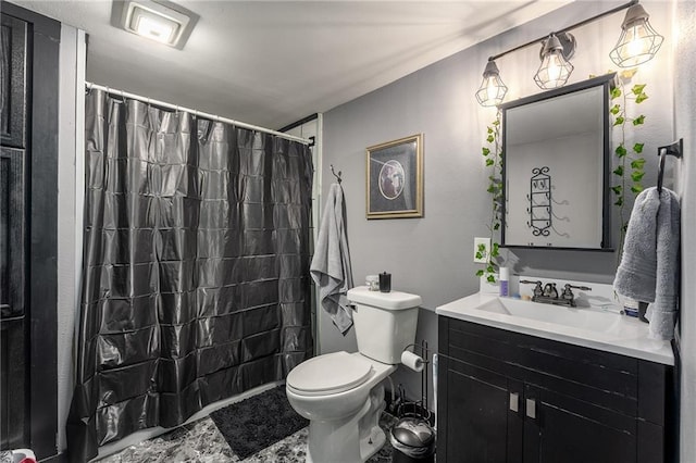 bathroom with vanity, a shower with shower curtain, and toilet