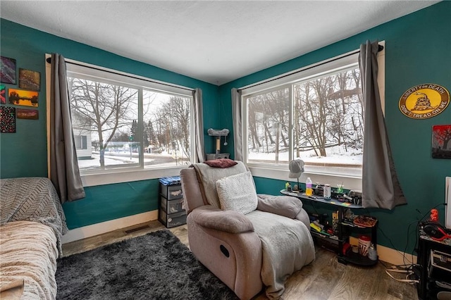 sitting room featuring wood finished floors and baseboards