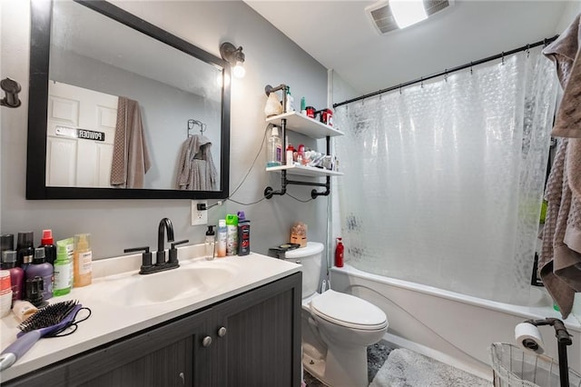 full bathroom featuring visible vents, shower / tub combo, toilet, and vanity