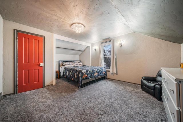 carpeted bedroom featuring lofted ceiling and a textured wall