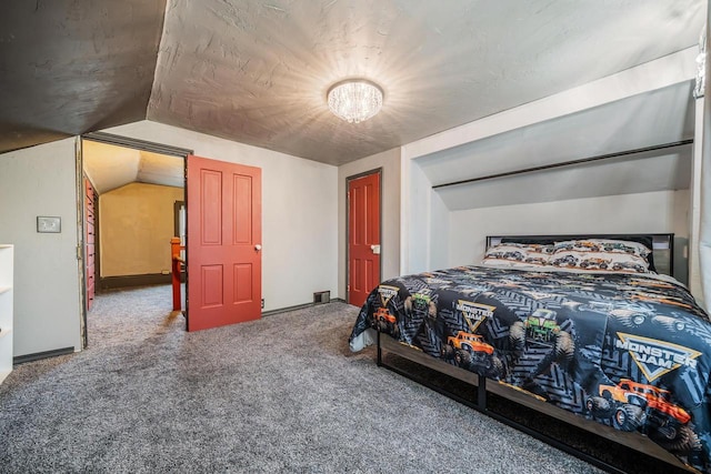 bedroom with carpet flooring and vaulted ceiling