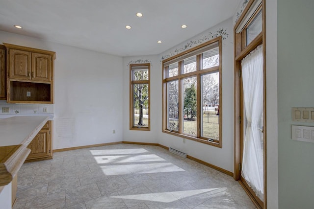 unfurnished dining area with recessed lighting, baseboards, and visible vents