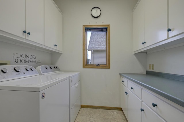 laundry room featuring cabinet space, washing machine and dryer, and baseboards