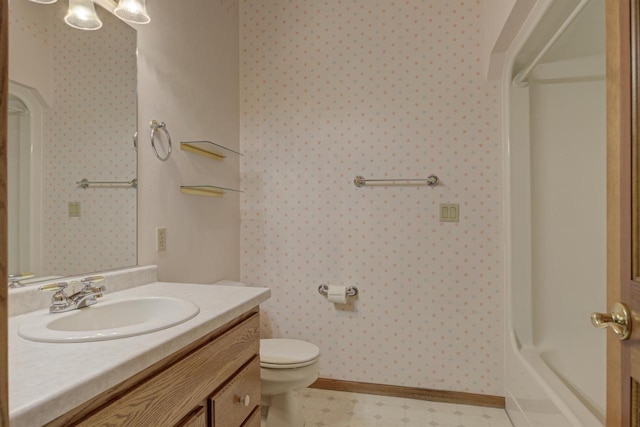 full bath with toilet, walk in shower, vanity, and wallpapered walls