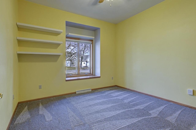 carpeted empty room featuring visible vents, a ceiling fan, and baseboards