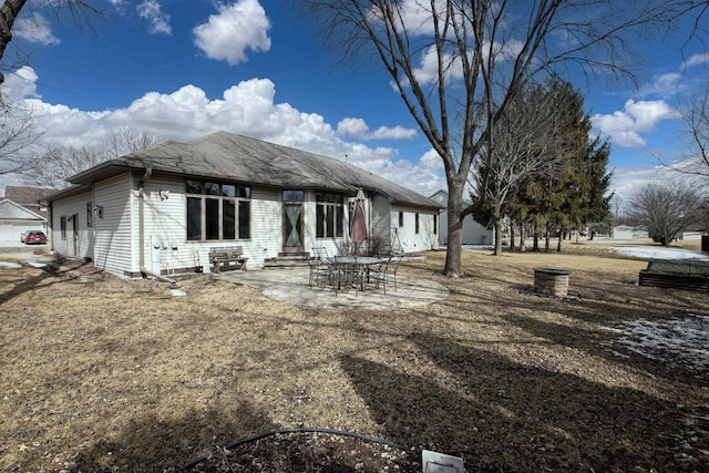 rear view of house with entry steps and a patio area