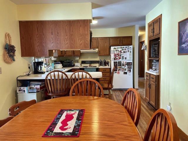 dining space featuring wood finished floors