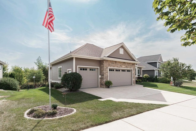784 Westbridge Trl, Waunakee, WI 53597 - craftsman-style house featuring a front yard, driveway, roof with shingles, an attached garage, and stone siding
