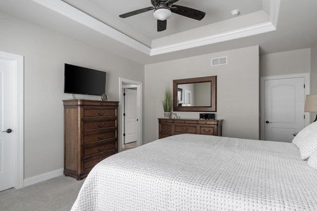 784 Westbridge Trl, Waunakee, WI 53597 - bedroom featuring visible vents, a tray ceiling, baseboards, light colored carpet, and ceiling fan