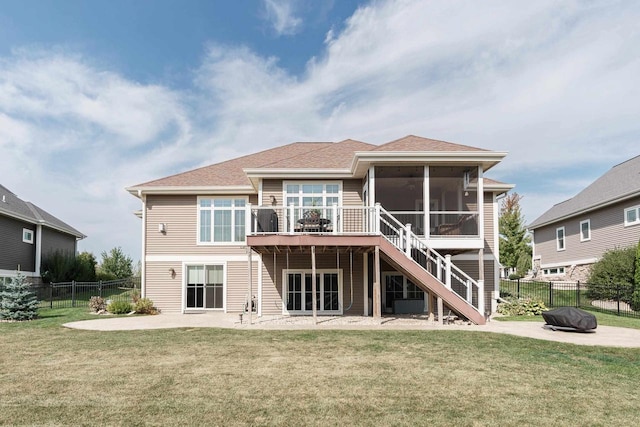 784 Westbridge Trl, Waunakee, WI 53597 - back of property with a yard, a fenced backyard, a sunroom, stairs, and a patio area