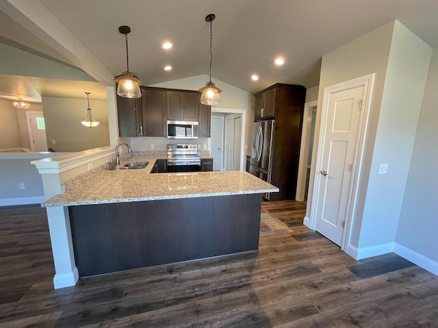 kitchen featuring dark wood finished floors, lofted ceiling, a peninsula, dark brown cabinets, and appliances with stainless steel finishes