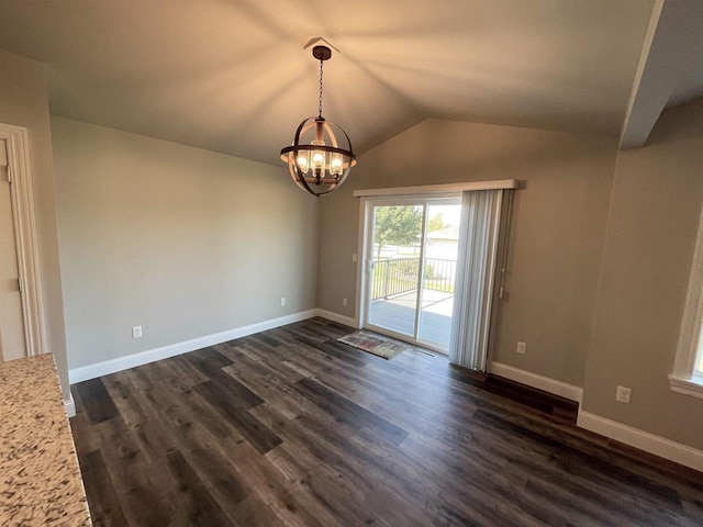 empty room with baseboards, a notable chandelier, dark wood-style flooring, and vaulted ceiling