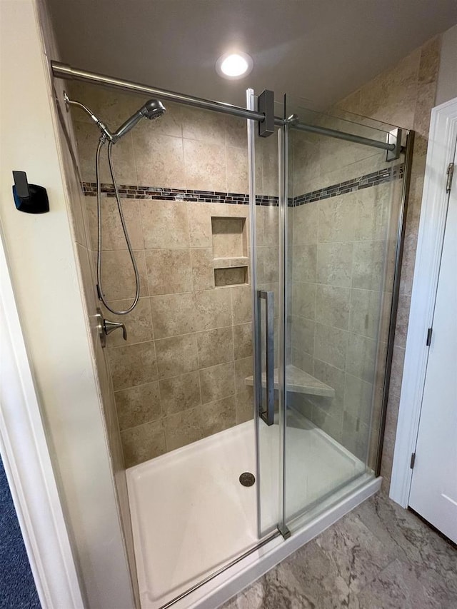 full bathroom with a shower stall