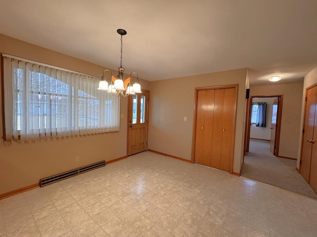 unfurnished room featuring a notable chandelier, light floors, baseboards, and a baseboard radiator