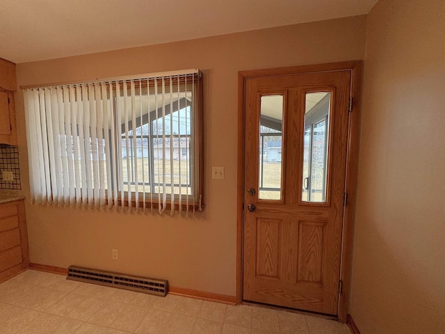 entryway featuring visible vents, baseboards, and light floors