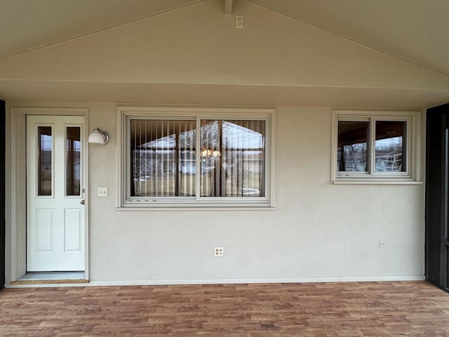 property entrance featuring stucco siding