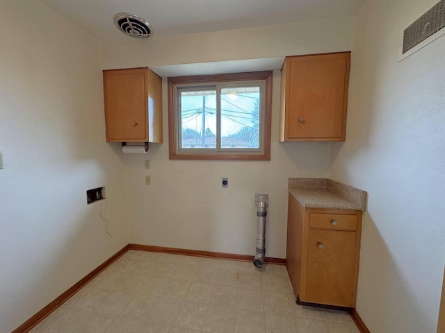 laundry room featuring visible vents and baseboards