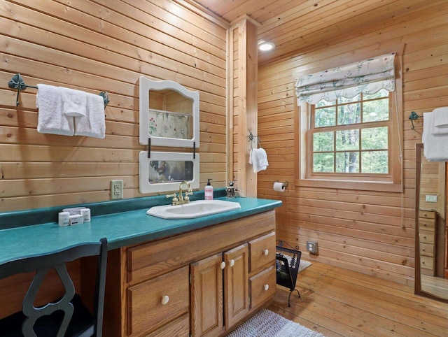 W3864 W Lemonweir Ct, Mauston, WI 53948 - bathroom featuring wooden walls, wood ceiling, vanity, and wood-type flooring