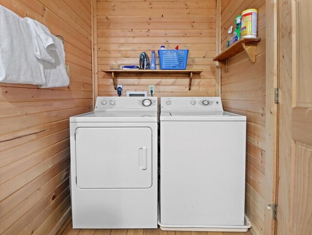 W3864 W Lemonweir Ct, Mauston, WI 53948 - laundry area with separate washer and dryer, wooden walls, and laundry area