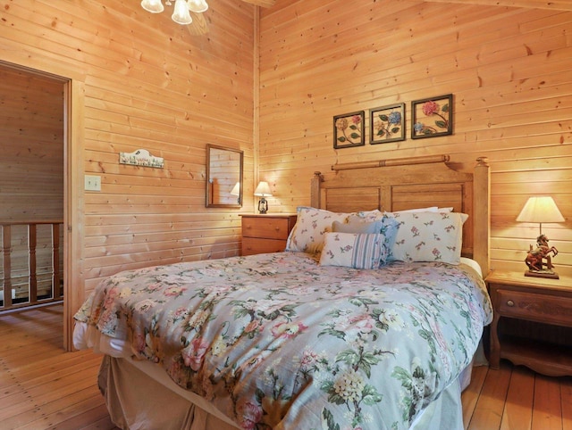 W3864 W Lemonweir Ct, Mauston, WI 53948 - bedroom with wooden walls and light wood-style flooring