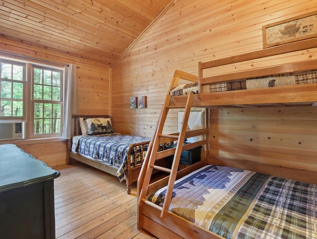 W3864 W Lemonweir Ct, Mauston, WI 53948 - bedroom featuring lofted ceiling, wood walls, wooden ceiling, and hardwood / wood-style flooring