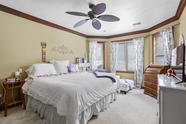 bedroom featuring light carpet, visible vents, crown molding, and a ceiling fan