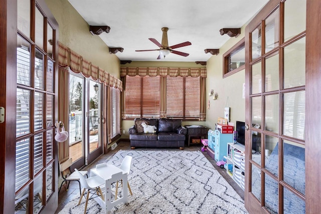 sunroom with a ceiling fan