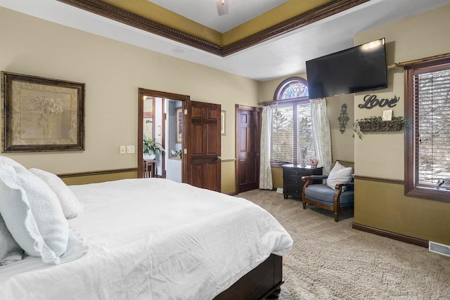 bedroom featuring light carpet, visible vents, and ceiling fan