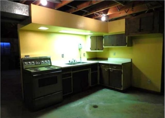 kitchen with black range with electric stovetop and a sink