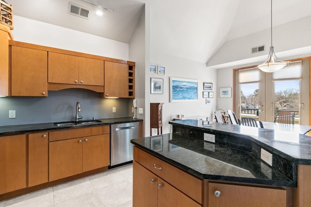 kitchen with dishwasher, lofted ceiling, visible vents, and a sink