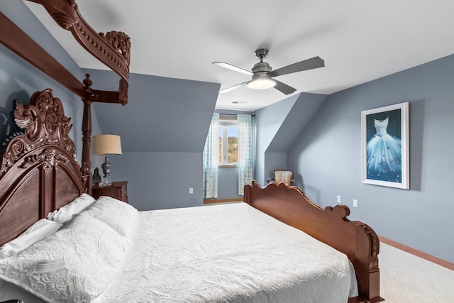 bedroom featuring vaulted ceiling, a ceiling fan, baseboards, and carpet floors