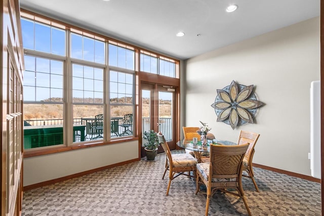 carpeted dining area featuring recessed lighting and baseboards