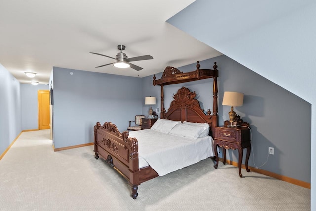 carpeted bedroom with a ceiling fan and baseboards