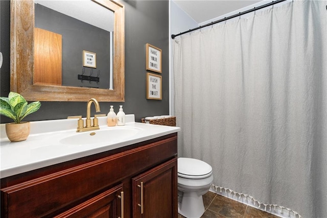 bathroom featuring curtained shower, toilet, and vanity