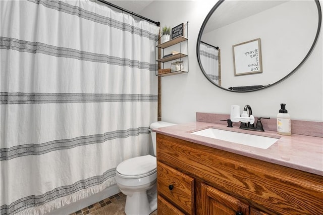 bathroom featuring vanity, toilet, and a shower with curtain