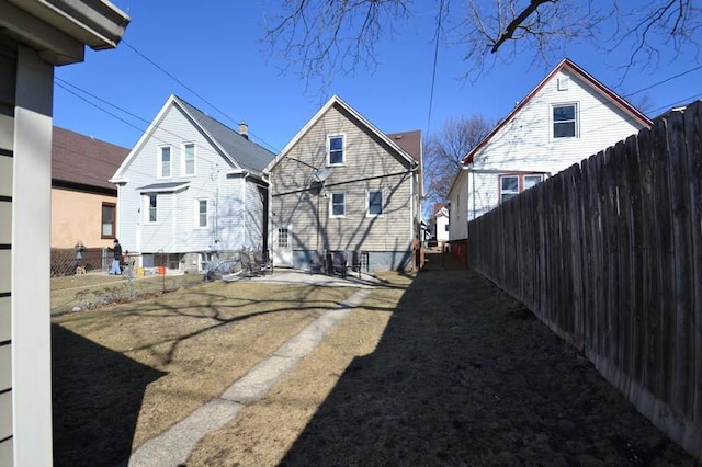 back of property featuring fence