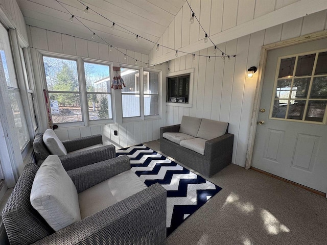 living area with vaulted ceiling