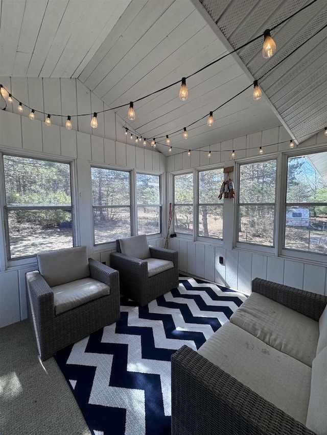 sunroom / solarium with track lighting, wooden ceiling, and vaulted ceiling