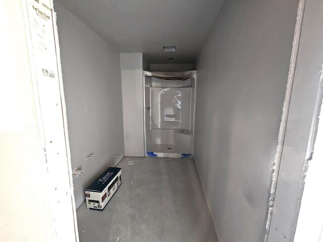 hallway featuring concrete flooring