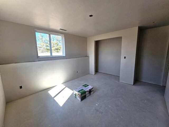 interior space with concrete flooring and visible vents