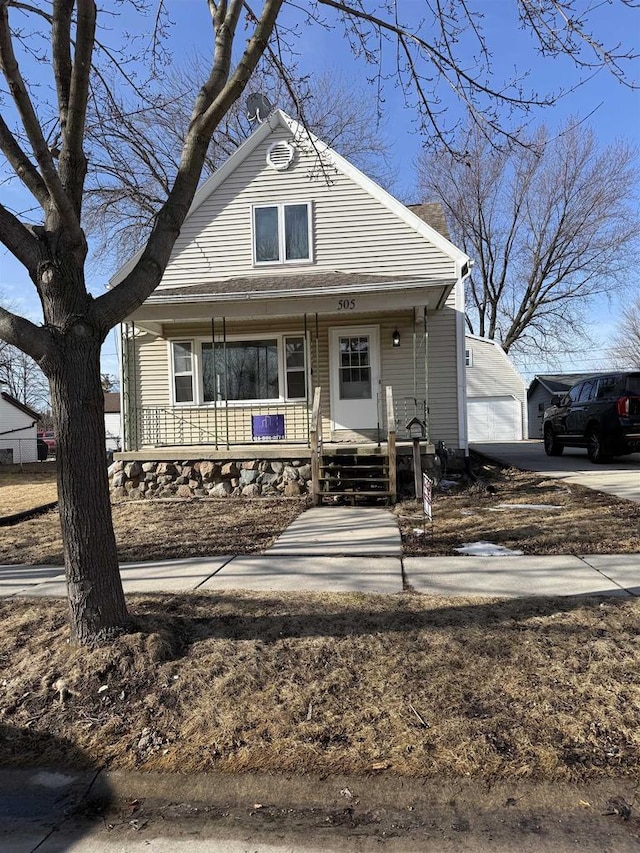 view of front of property featuring a garage and covered porch