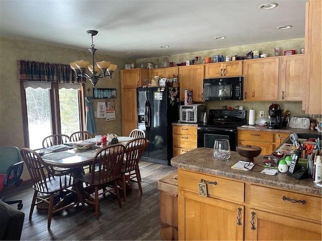 kitchen with dark wood-style floors, a chandelier, recessed lighting, and black appliances