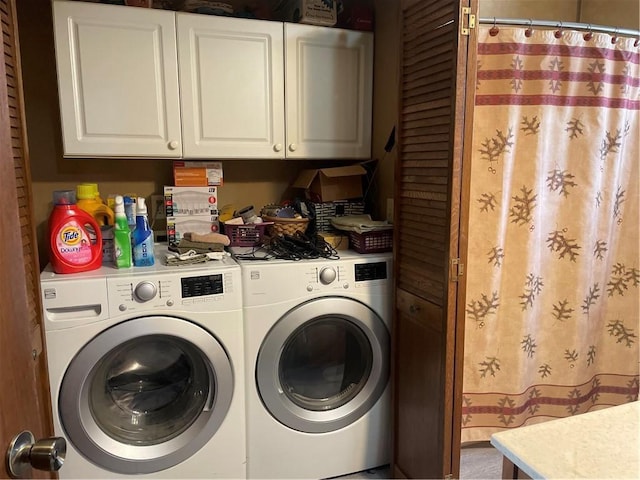 washroom featuring washer and dryer