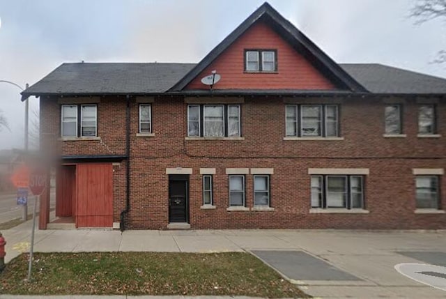 exterior space with brick siding