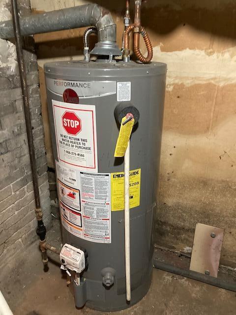 utility room with gas water heater