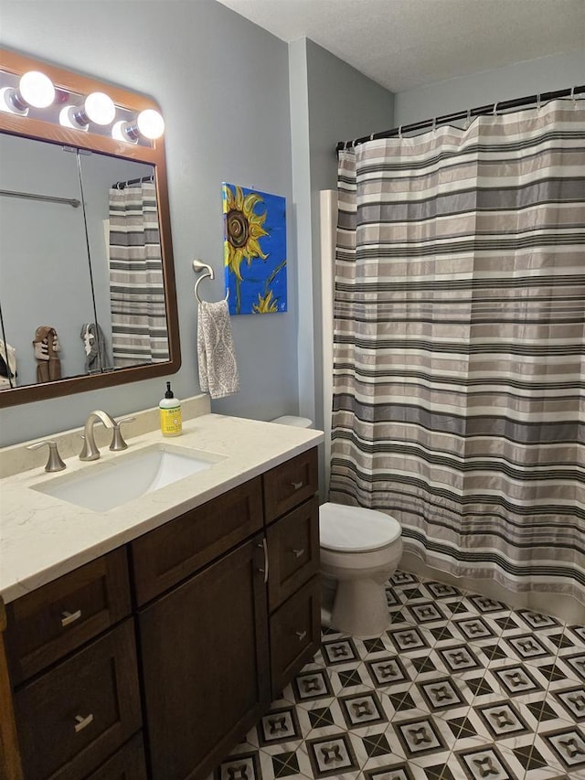 full bathroom featuring toilet and vanity