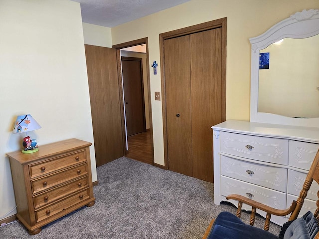 carpeted bedroom with a closet