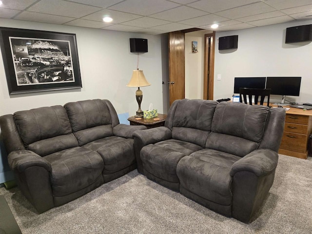 carpeted living area with a drop ceiling and recessed lighting